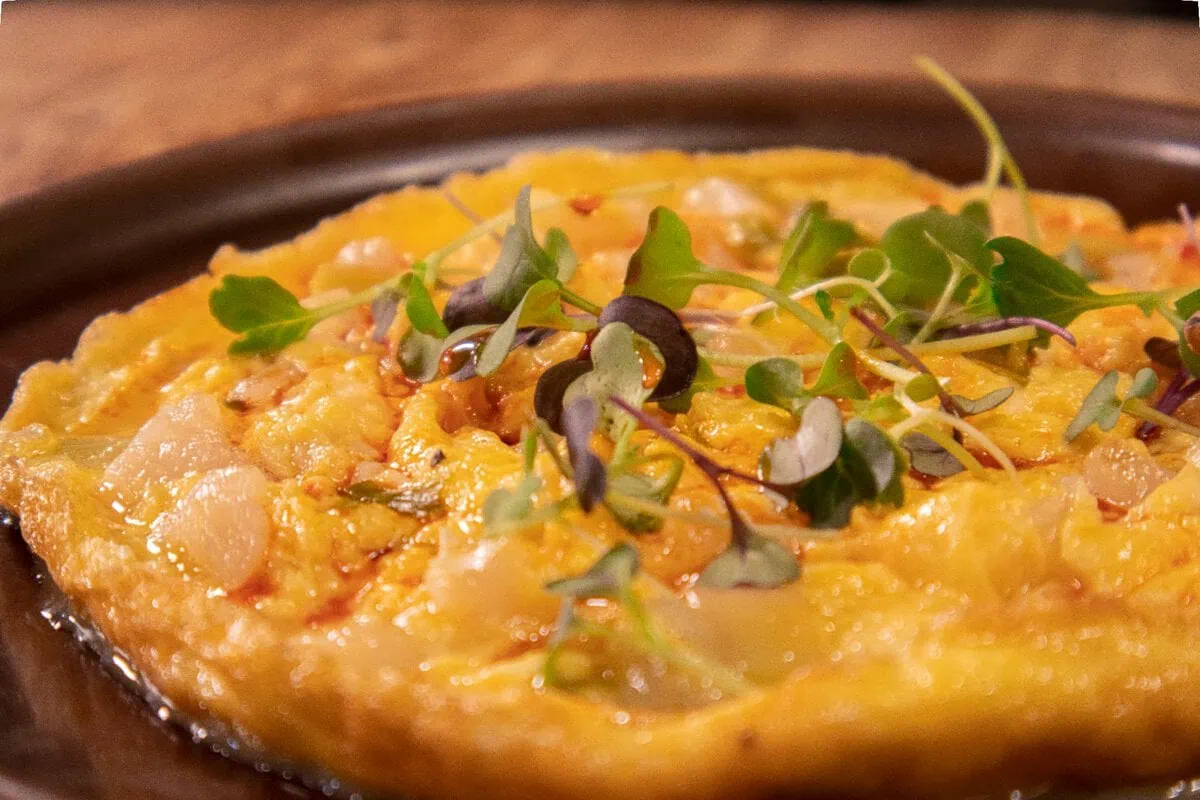 Open cod omelette with spring garlic